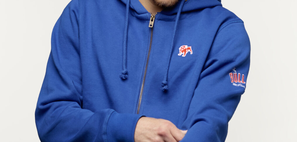 Young man wearing a Bulldog Factory hoodie featuring an embroidered bulldog logo